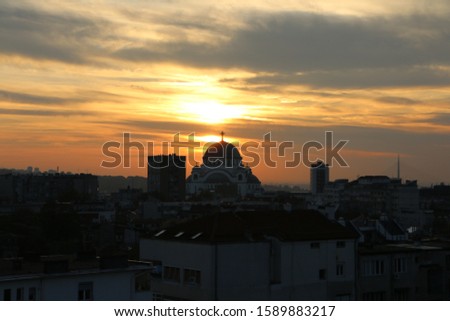 Amazing sunset from Belgrade rooftops with St. Sava Church