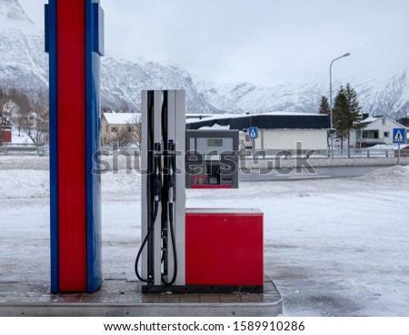 Fuel Dispenser with gas nozzle in gasoline station on winter season at Scandinavia 