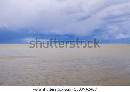 stormy sea in the picture divided by sea and sky exactly in half