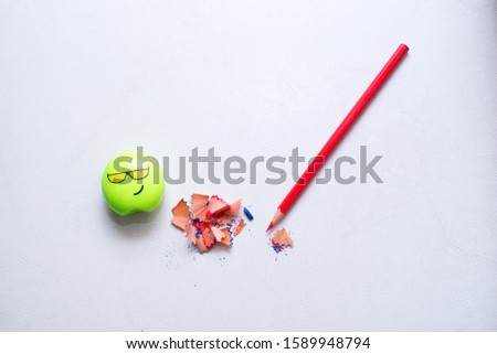 Pencil sharpener. sharpened red pencil and sharpener on a white background
