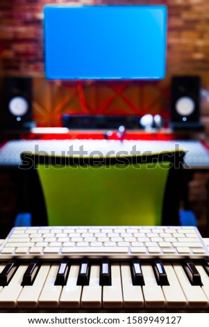midi keyboard in recording studio. music background