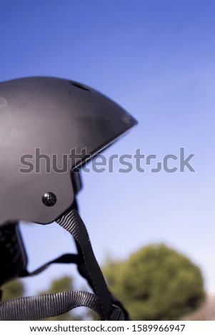 Black safety helmet for skates. No people