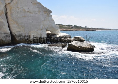 Rosh Hanikra grottoes rocks and caves famous nature tourist site (attraction) in north-western Israel (Galilee region), near Nahariya, in Mediterranean Sea. geological creation in coastline (shore). Royalty-Free Stock Photo #1590010315