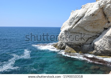Rosh Hanikra grottoes rocks and caves famous nature tourist site (attraction) in north-western Israel (Galilee region), near Nahariya, in Mediterranean Sea. geological creation in coastline (shore). Royalty-Free Stock Photo #1590010318