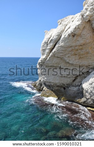 Rosh Hanikra grottoes rocks and caves famous nature tourist site (attraction) in north-western Israel (Galilee region), near Nahariya, in Mediterranean Sea. geological creation in coastline (shore). Royalty-Free Stock Photo #1590010321