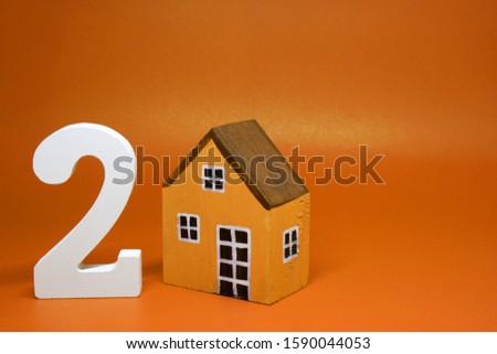 Two ( 2 ) House Isolated Orange Background with Copy Space - Second hand home or Used house Business building finance Concept