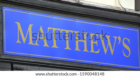 a street sign that reads Mathew's