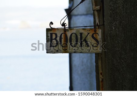 old book sign on building 