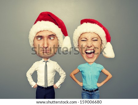 funny picture of santa couple over grey background