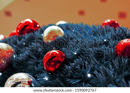 Colorful ball on a Christmas tree with abstract bokeh light.