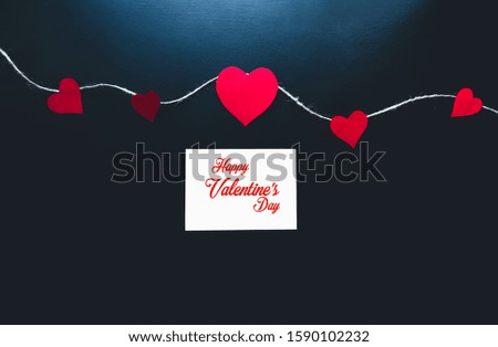 Valentine's day background with red hearts and text with a top view.