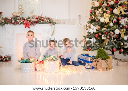 children near Christmas tree,happy New Year