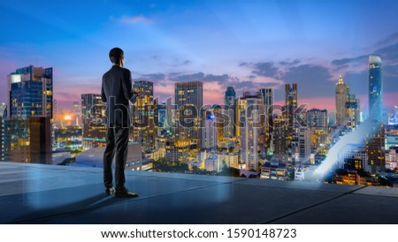 Businessman standing on  roof top,The readiness of leaders,vision and Targeting the business concept. Royalty-Free Stock Photo #1590148723
