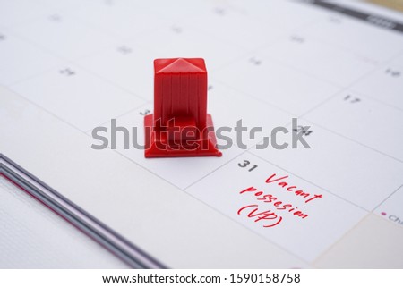 A Property conceptual, calendar with hand written vacant possession VP. The right of a purchaser to exclusive use of a property on completion of the sale