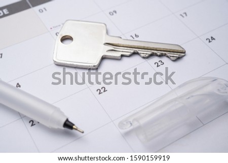 A property conceptual with calendar, pen and key. Home loan, home insurance, family life assurance protection, financial mortgage for house building, and legacy planning investment concept