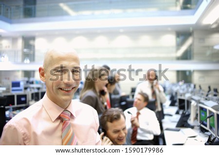 Businesspeople working at stock market