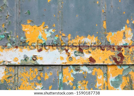Texture photo. Peeling paint vintage texture. Grunge style old wooden door background.