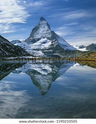 The Matterhorn reflected in Riffelsee, Zermatt, Valais Canton, Switzerland