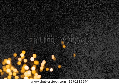 Golden lights on dark background