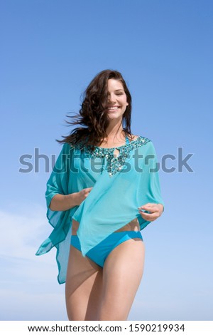 Woman wearing bikini and cover-up