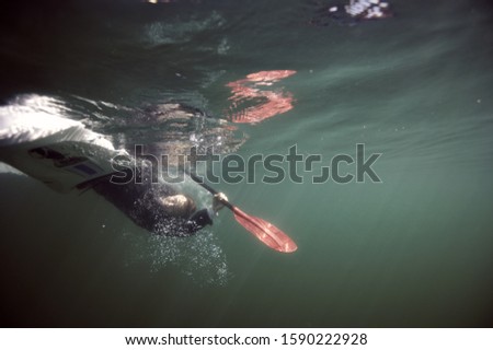 Underwater shot of person on side in kayak