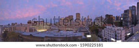 panorama view of the city of montreal during a sunset with a pink and purple sky