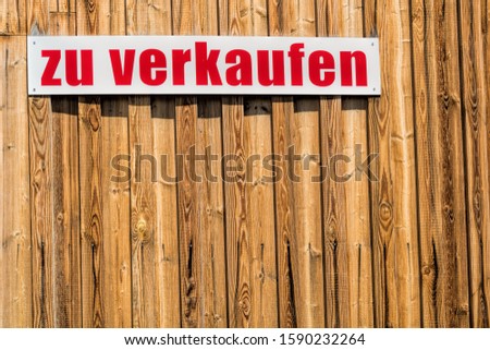 wooden wall with sign and text - for sale