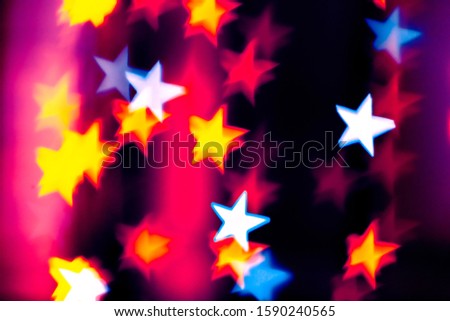 Festive overlay effect. Colorful stars bokeh festive glitter background. Christmas, New Year and Valentine's day design
