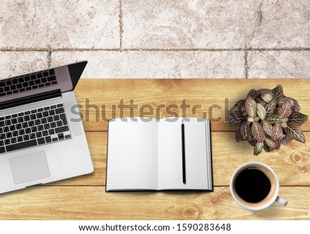 Business workplace, laptop coffee and notebook on desk