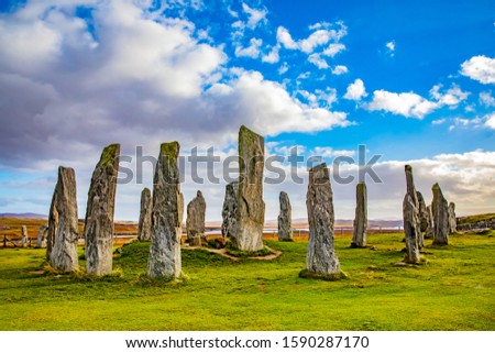 Scotland, Outer Hebrides, Lewis and Harris, The Callanish Stones are an arrangement of standing stones placed in a cruciform pattern with a central stone circle. Royalty-Free Stock Photo #1590287170