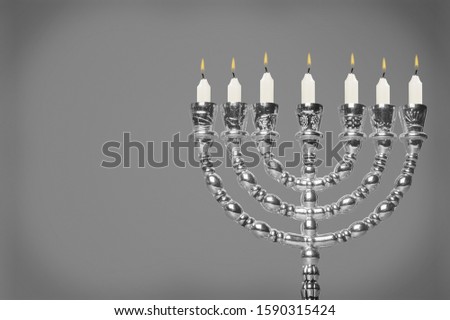 Religion jewish Hanukkah with menorah and candles on background