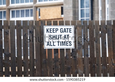 School gate to keep shut sign in grounds for security to children