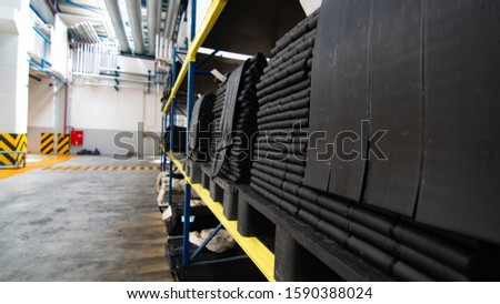 rubber compound waiting on shelves after mixing process Royalty-Free Stock Photo #1590388024