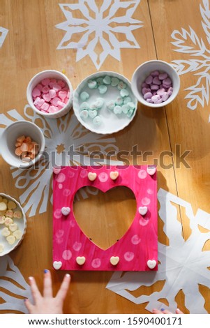 Young kids making Valentine's Day gifts