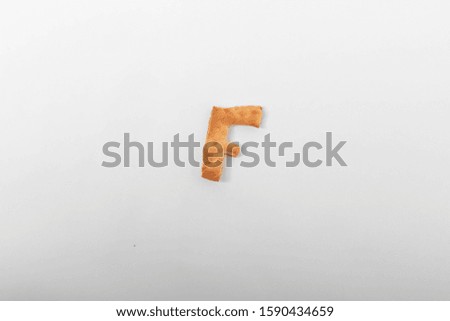 letters from biscuits on a white background