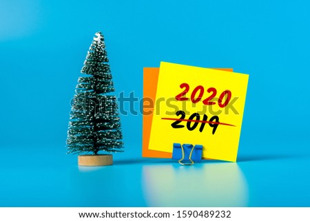 Business New Year concept - little Christmas tree with message 2020 is replacing 2019. Goals 2020