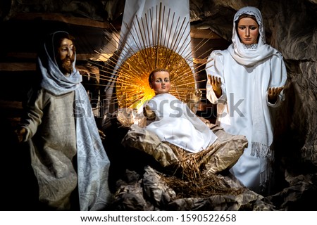 Folk art - Christmas decorations. Jesus, Maria and Joseph  in a cradle