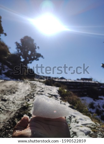 Snow ball melting under Sun