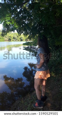 Girl in front a lake