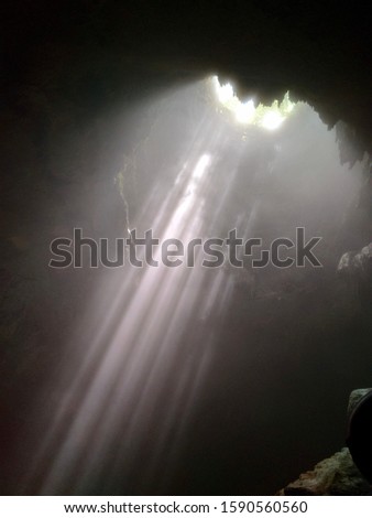 Jomblang Cave Heaven Light Beam at Yogyakarta, Indonesia.