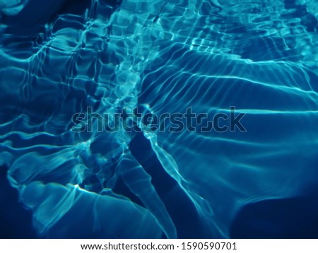 The wave blue water under sea effected by sun light