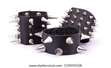 Rock leather bracelets on white background