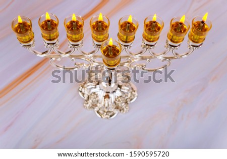 Closeup of a burning Chanukah candlestick with candles Menorah a traditional Jewish holiday