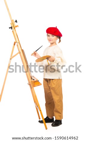 A full length portrait of a girl painting a picture. Creativity, artist.
