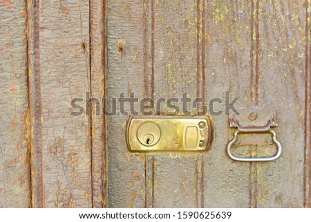 Door with a lock. Urban photo.