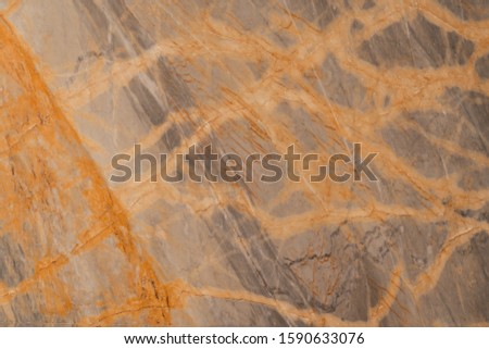 Natural marble with ripple mineral in yellow color / facade decoration / background texture / seamless pattern