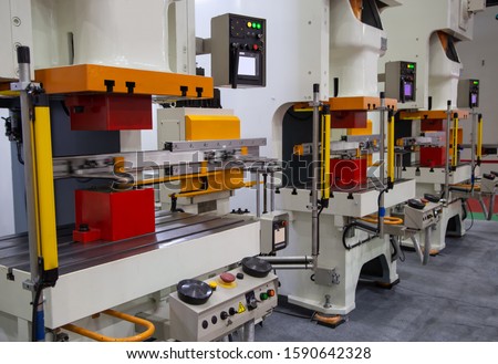 Automation hydraulic press stamping machine on process in production line. Industrial metalworking machinery Royalty-Free Stock Photo #1590642328