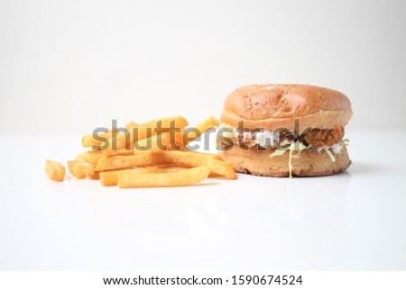 burger with potato fries served on white background