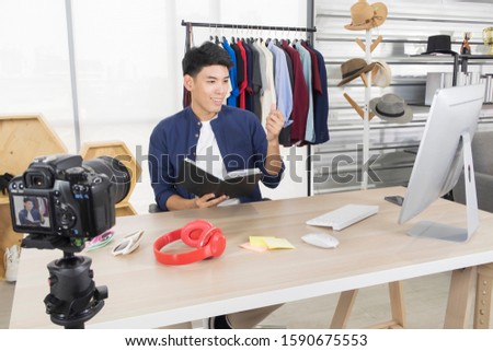 Young Happy Asian man gets a new idea for sharing content on live streaming make video broadcast with internet subscribers. Business, startup, e-commerce, social media, marketing online concept.