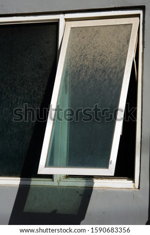 window on building and light on widow